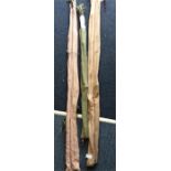 Three split cane fishing rods.