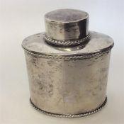 An oval boat shaped tea caddy with gadroon rim and