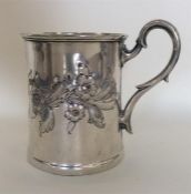 A Continental christening cup heavily decorated wi