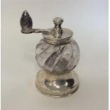 A good quality silver mounted and glass pepper gri