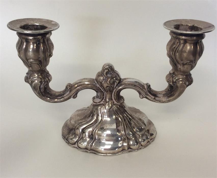 An unusual Continental silver candelabra with mold