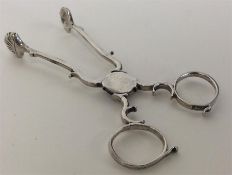 A pair of Georgian silver sugar scissors of typica