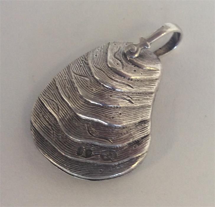 An unusual in date Victorian silver pendant in the