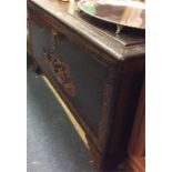 A carved hardwood trunk.