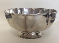 A Chinese silver rose bowl with wavy edge. Punched