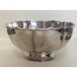 A Chinese silver rose bowl with wavy edge. Punched