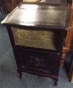 An Edwardian hinged top cupboard.