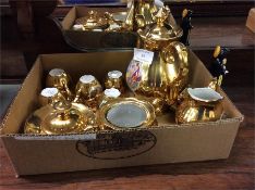 A decorative gilt part tea service.