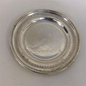 A Victorian bright cut silver saucer. Birmingham.