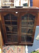 An oak two door display cabinet.