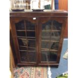 An oak two door display cabinet.