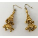 A pair of high carat filigree drop earrings with l