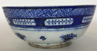 A Persian blue and white ground pottery bowl decor