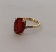 A rare fire opal mounted as a single stone ring wi