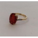 A rare fire opal mounted as a single stone ring wi