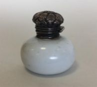 An attractive miniature silver mounted scent bottl