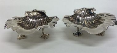 A pair of Georgian silver shell-shaped salts with