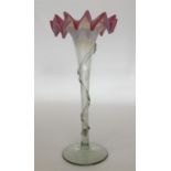 A glass flaring vase with wavy vaseline and ruby r