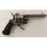 A small pin-fire revolver with chequer handle. Est