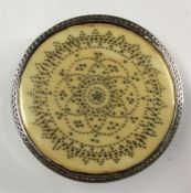 A good quality ivory-inlaid circular pill box of c