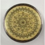 A good quality ivory-inlaid circular pill box of c