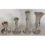 A group of three silver candlesticks of typical de