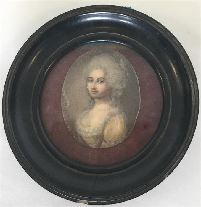 An oval miniature in an ebony frame of a lady in y