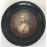 An oval miniature in an ebony frame of a lady in y