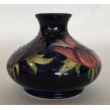 MOORCROFT: A small blue-ground oviform vase decora