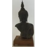 An Islamic bronze figure on stepped base. Approx.