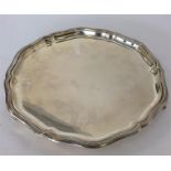 A plain silver salver with swirl decoration. Sheff