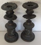A pair of brass candlesticks with gadroon rims. Es