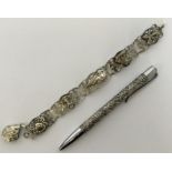 A Sterling silver pencil together with a gilt brac