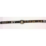 A good leather belt containing cap badges and Mili