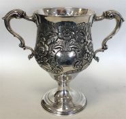 A George III heavy Irish silver embossed two-handl