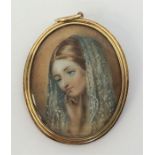 An attractive oval gold miniature of a lady with s