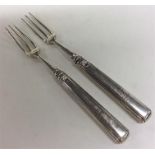 A pair of Antique Irish silver forks with tapered