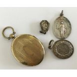 A silver medallion locket etc. Est. £20 - £30.
