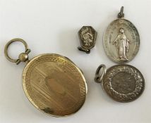 A silver medallion locket etc. Est. £20 - £30.