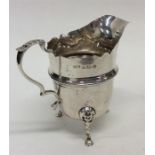 A small Edwardian silver helmet-shaped cream jug w