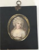 An oval miniature of a lady with wavy hair on a br