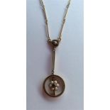 A pearl and sapphire pendant in 15 carat on chain.