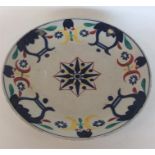 A large Japanese porcelain saucer dish brightly pa