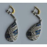 A pair of attractive teardrop earrings decorated w