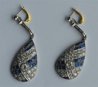 A pair of attractive teardrop earrings decorated w
