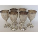 A set of six Sterling silver goblets of tapering form on