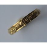 A gold hinged keeper ring with hair centre. Approx