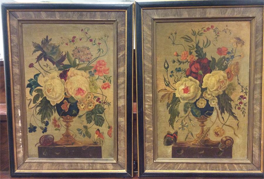 A pair of framed still life oil paintings depictin