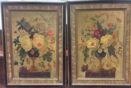 A pair of framed still life oil paintings depictin