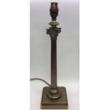 A brass Corinthian column lamp of typical design.